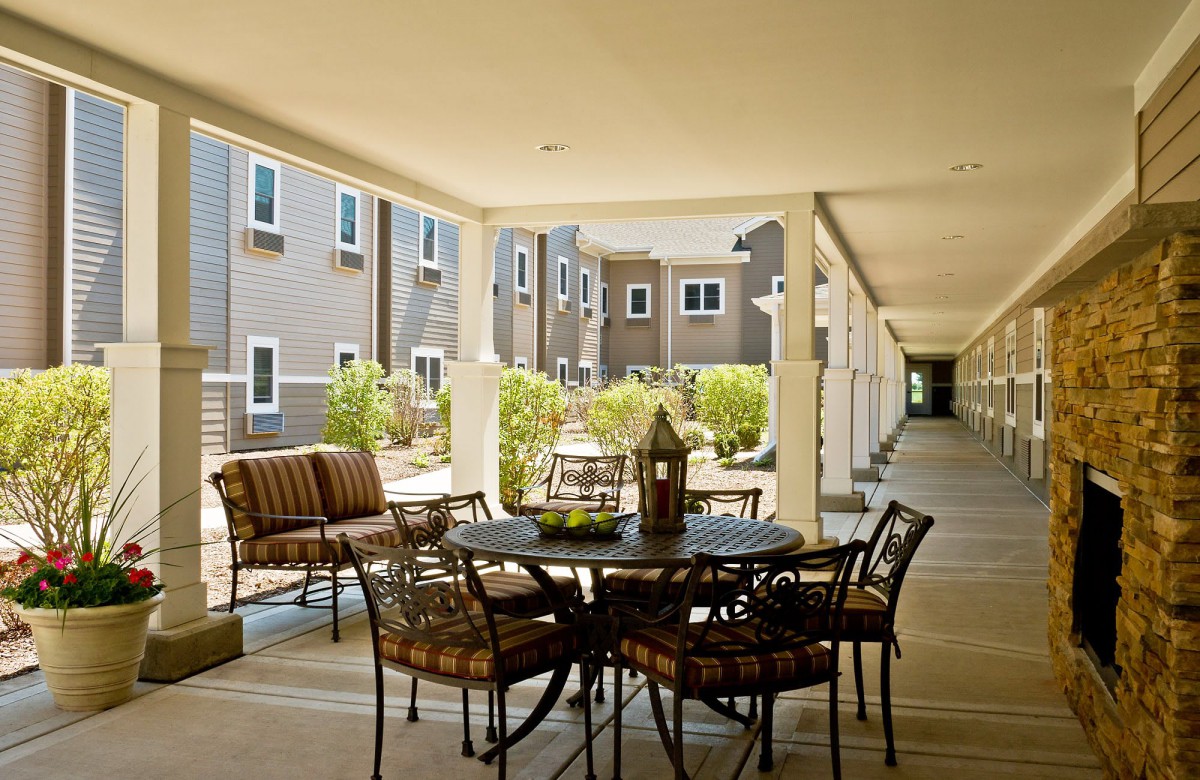 A cozy outdoor seating area in an apartment complex courtyard.