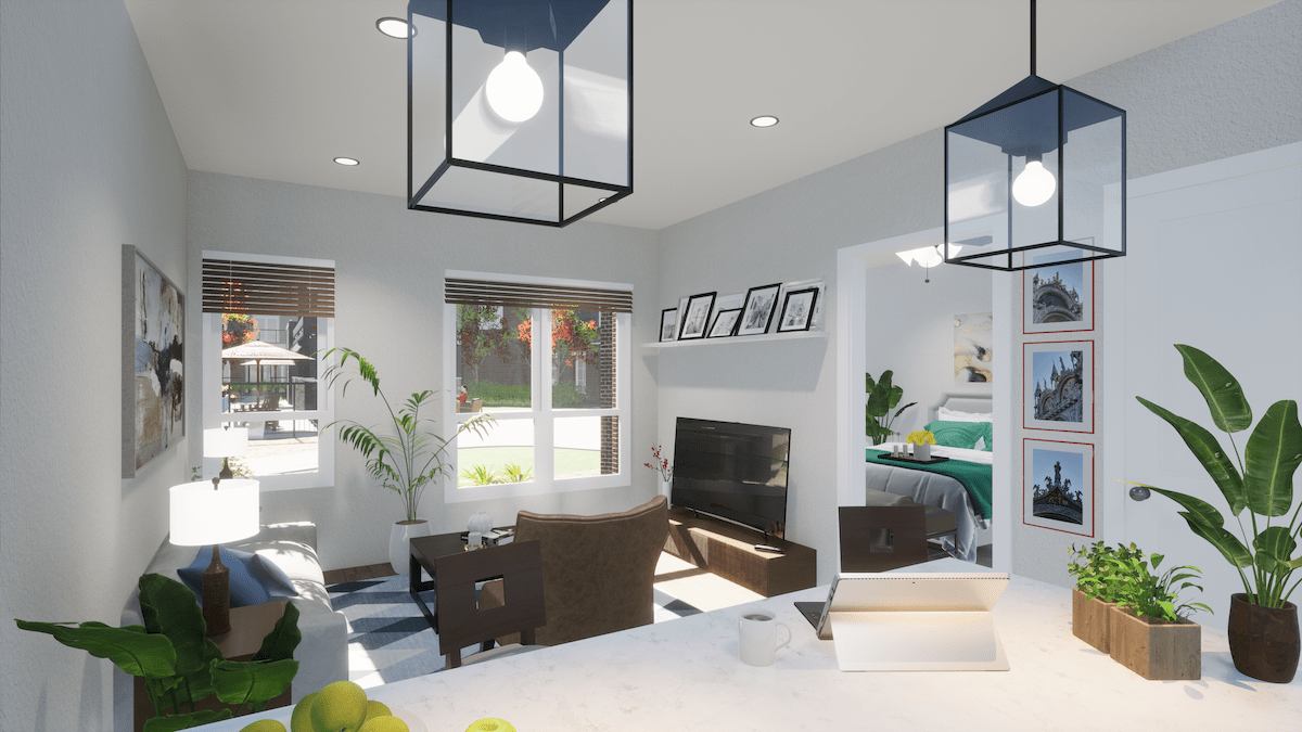 A modern living room featuring stylish furniture and ample natural light.