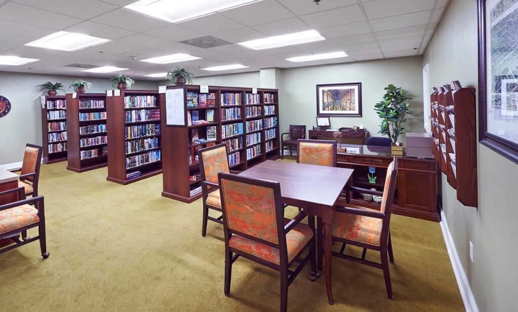 A quiet library reading area with bookshelves and seating.