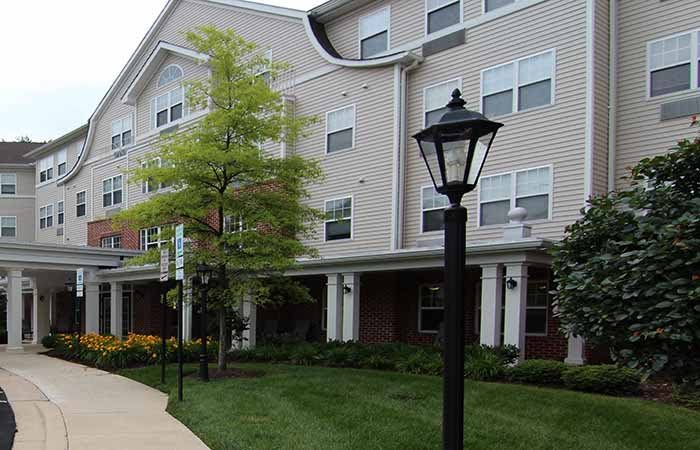 A residential apartment building with landscaped surroundings.