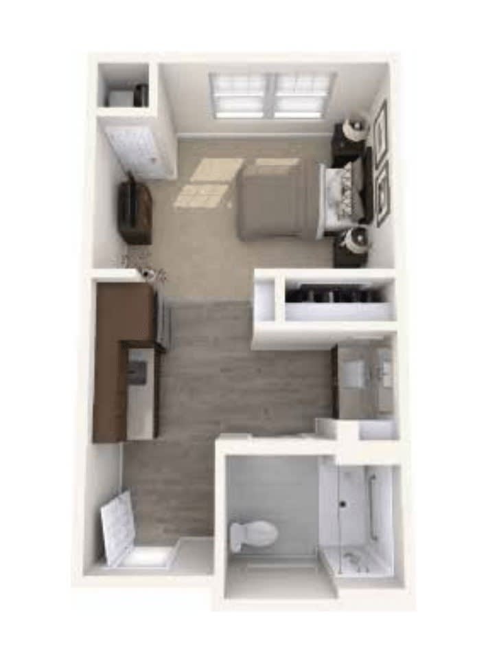 A compact apartment floor plan showing a bedroom, kitchen, and bathroom.