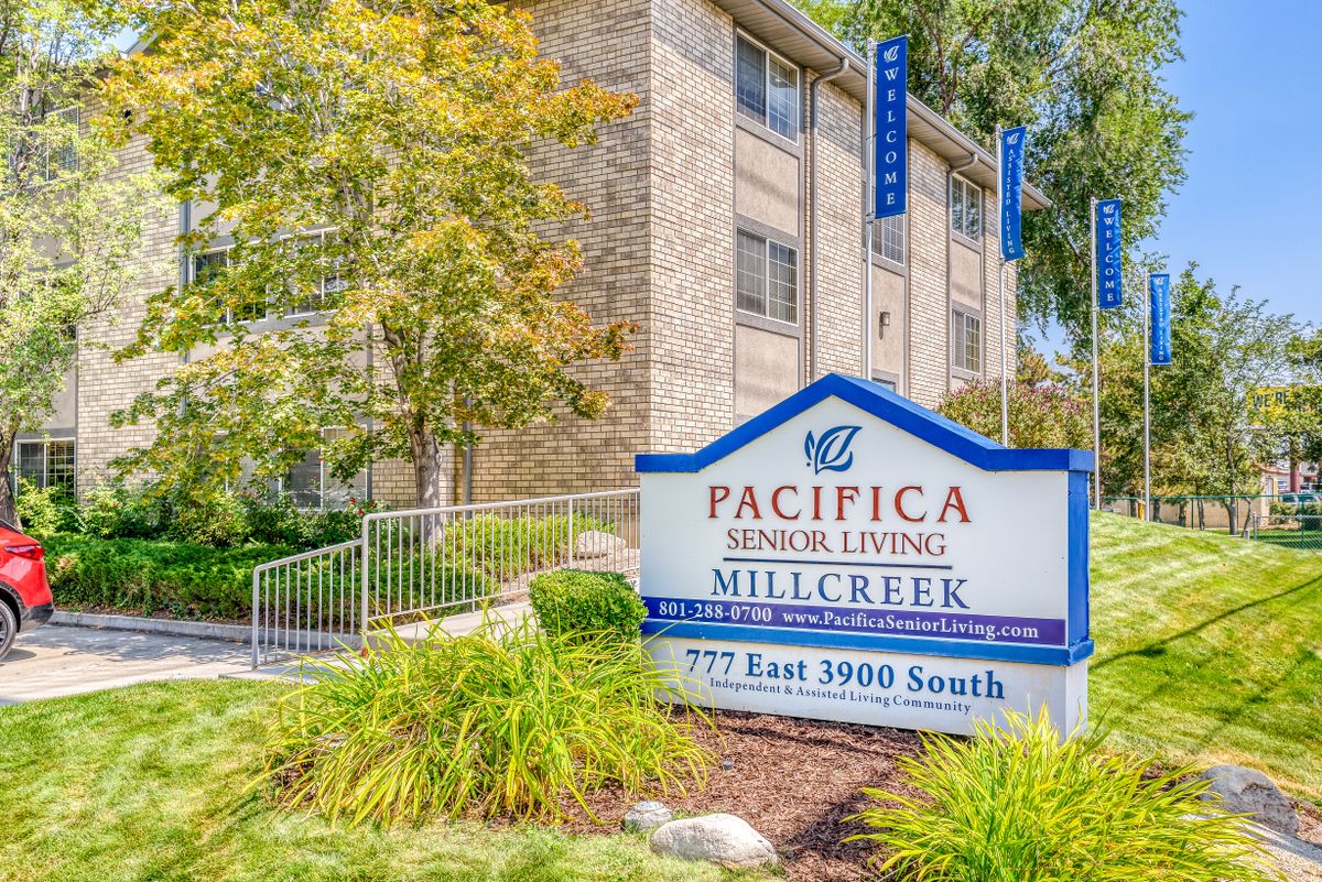 Pacifica Senior Living Millcreek entrance with signage and landscaping.