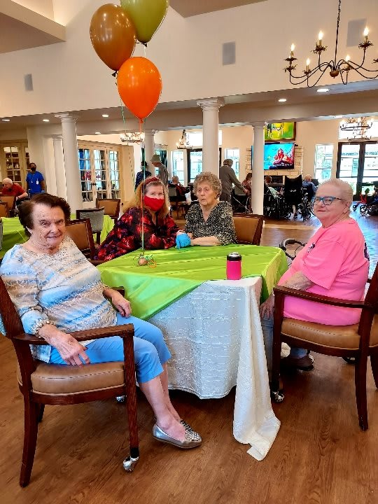 A group of seniors enjoying a social gathering at a community center.