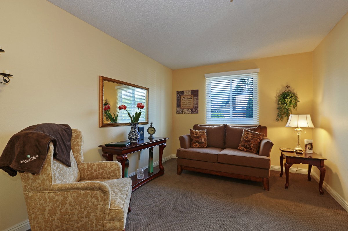 A cozy living room with comfortable seating and tasteful decor.