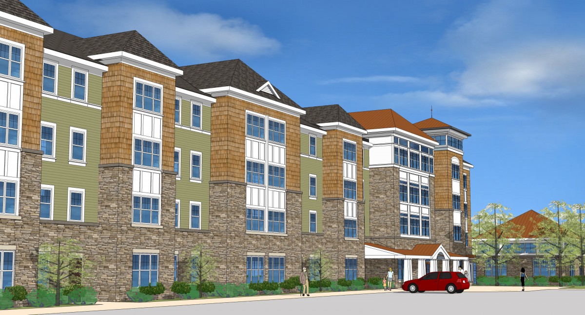 A modern residential apartment complex with multiple stories and a mix of stone and siding exterior.