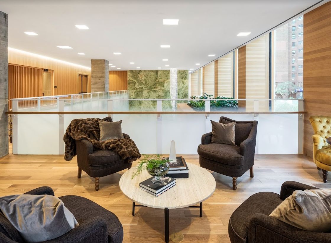 A modern lounge area with comfortable seating and a stylish coffee table.
