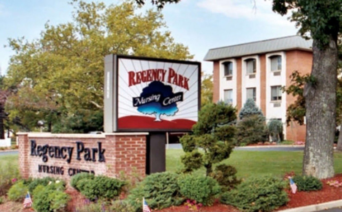Exterior view of a building with a sign labeled 'Regency Park'.
