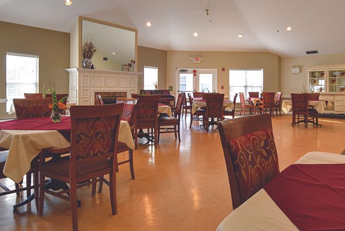A cozy dining area with neatly arranged tables and chairs.