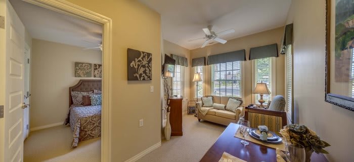A cozy living room with comfortable seating and large windows.