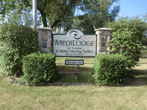 Entrance sign for MediLodge, a skilled nursing facility.