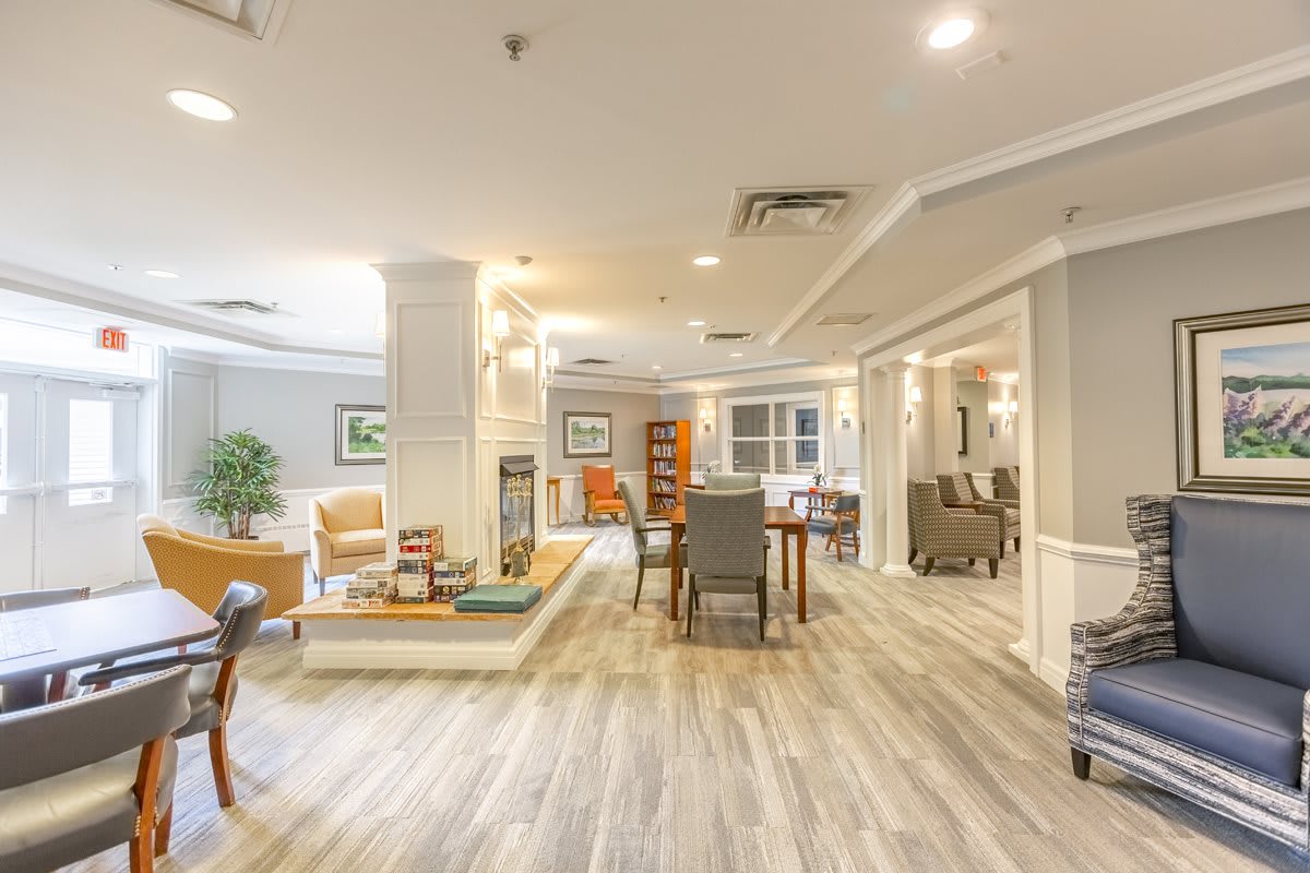 A spacious and modern living area with stylish furniture and warm lighting.
