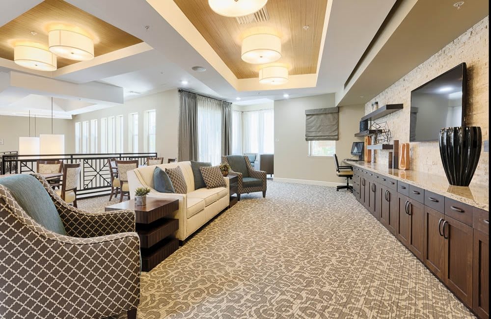 A modern and elegantly designed lounge area with comfortable seating and stylish lighting.