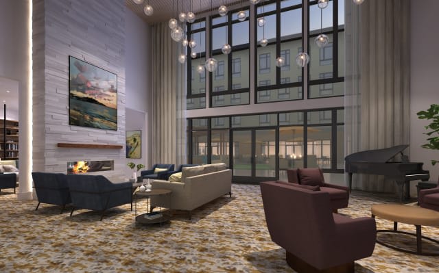 A modern living room with cozy seating, large windows, and stylish decor.
