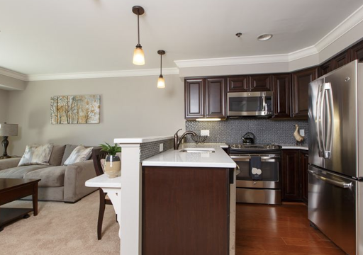 A contemporary kitchen featuring modern appliances and stylish decor.