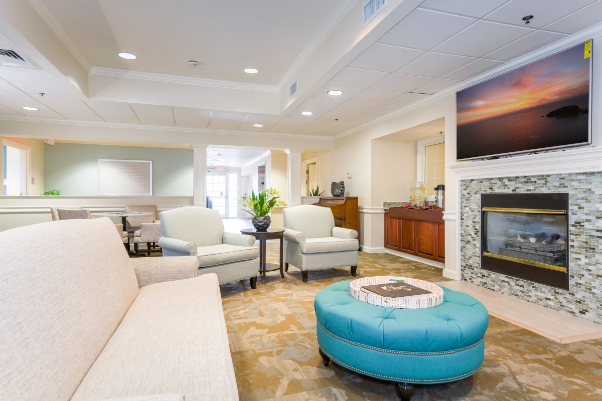 A modern living room with comfortable seating and elegant decor.