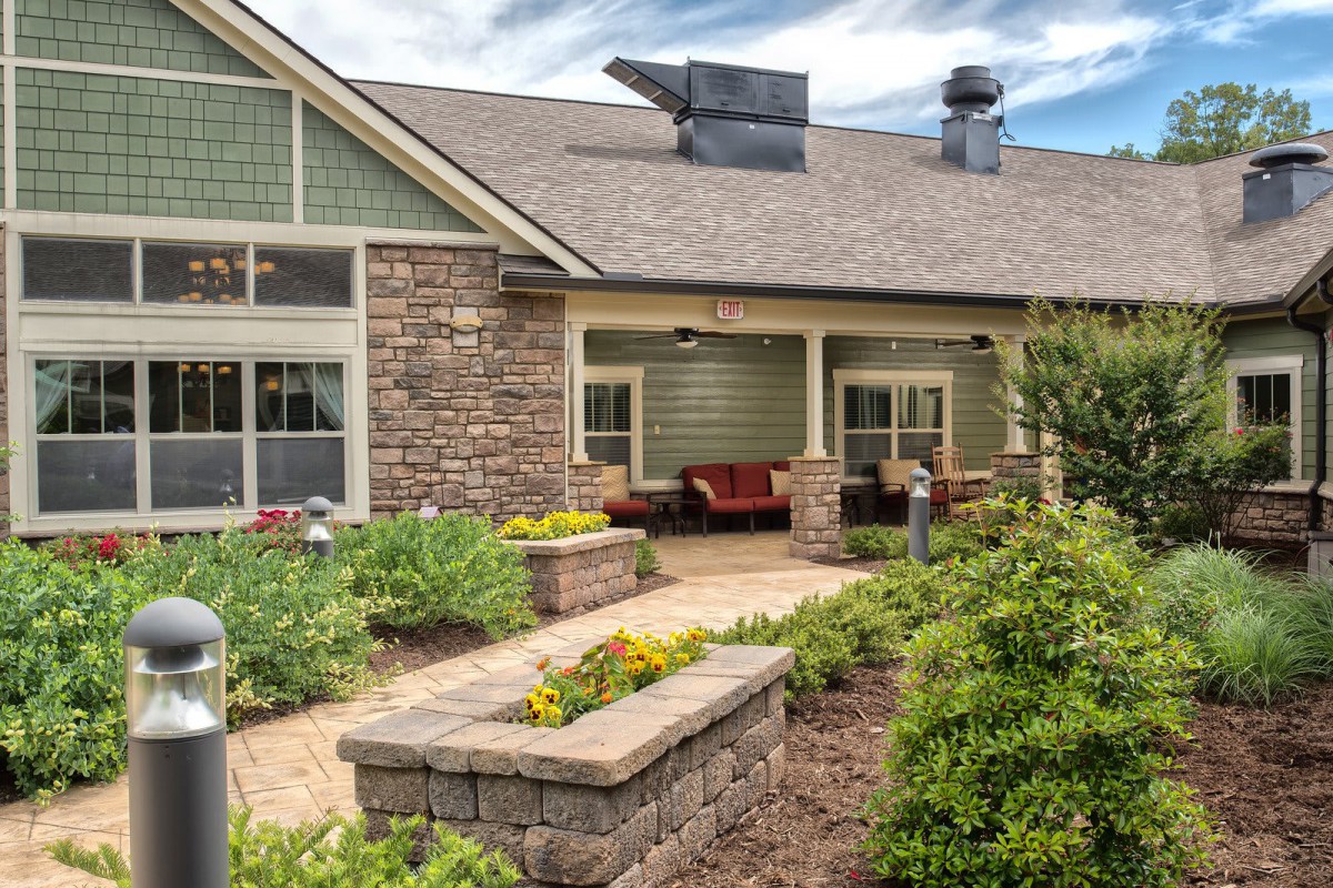A charming residential house with beautiful landscaping and garden.