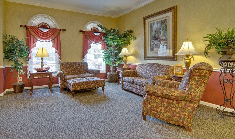 A cozy living room with traditional furniture and warm lighting.