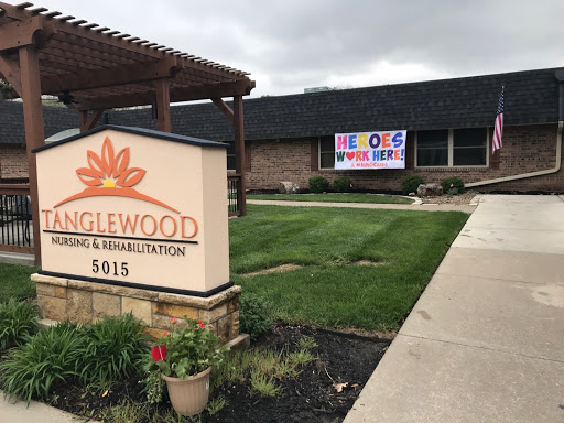 A community center named 'Eaglewood' featuring a welcoming sign and a colorful banner.