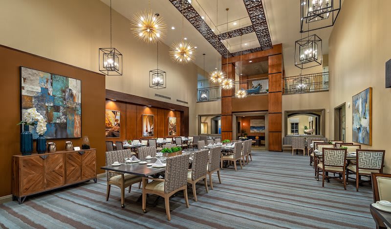A modern dining area with elegant lighting and contemporary decor.