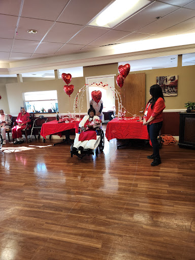A festive Valentine's Day celebration at a community center, with decorations and joyful participants.