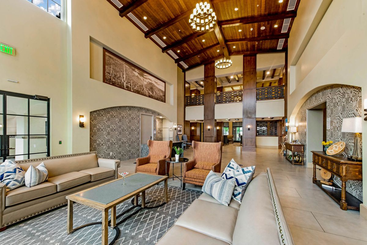 Spacious and elegantly designed hotel lobby with comfortable seating and warm lighting.