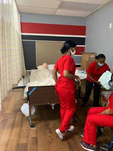 Nursing students engaged in practical training in a healthcare simulation lab.