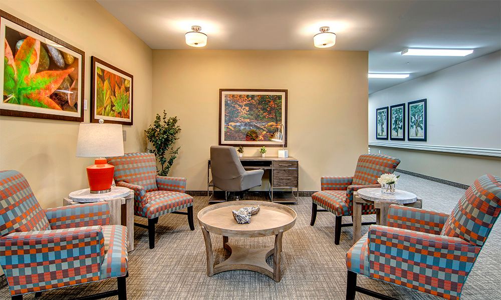 A cozy living room with modern furniture and decorative artwork.