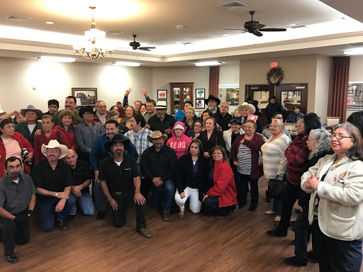 A joyful gathering of community members celebrating together.
