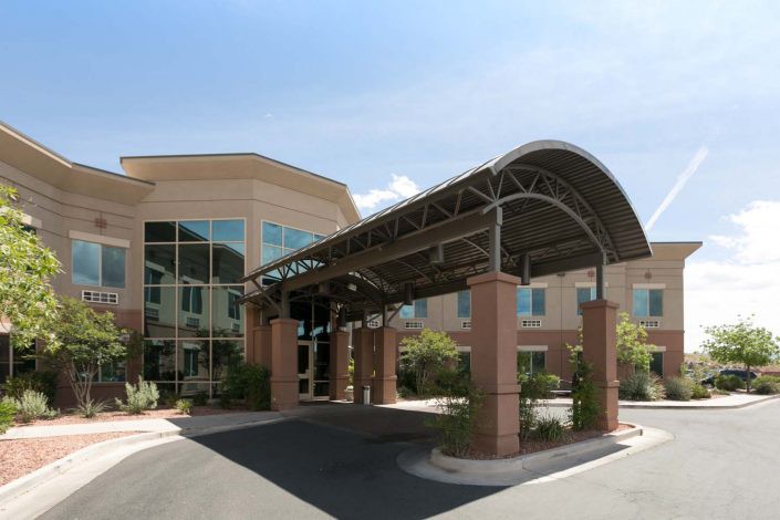 A modern building entrance with a covered canopy.