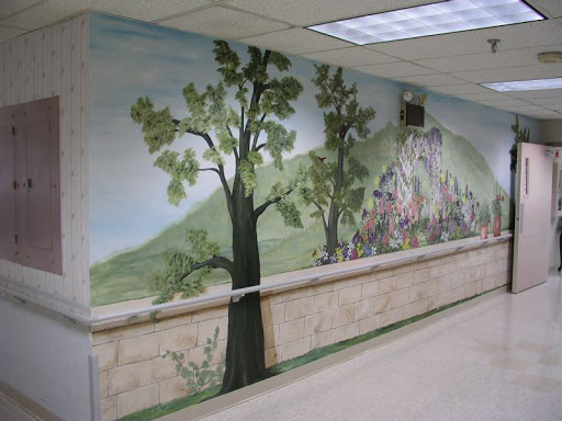 A beautifully painted mural depicting trees and a natural landscape, enhancing the interior hallway.