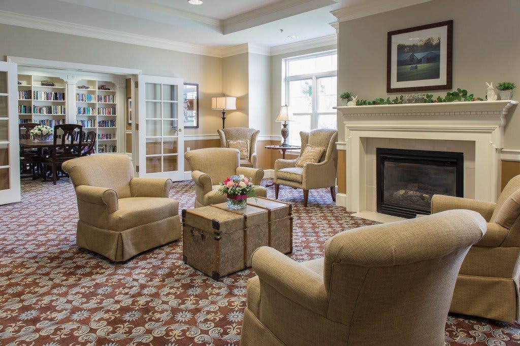 A cozy living room with comfortable seating and a fireplace.