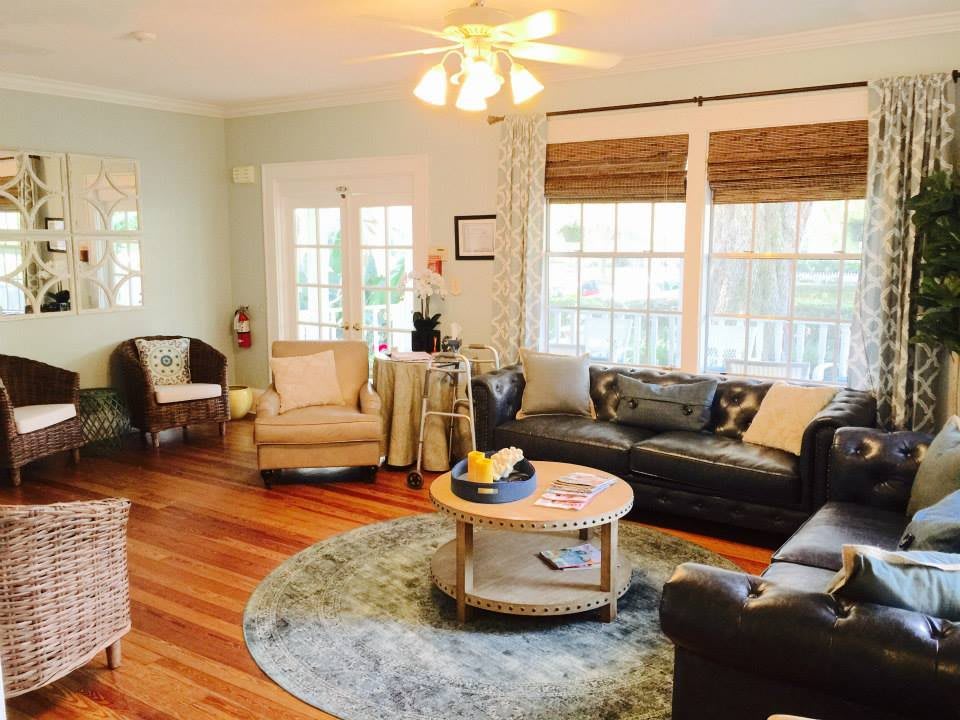 A cozy living room with comfortable seating and natural lighting.