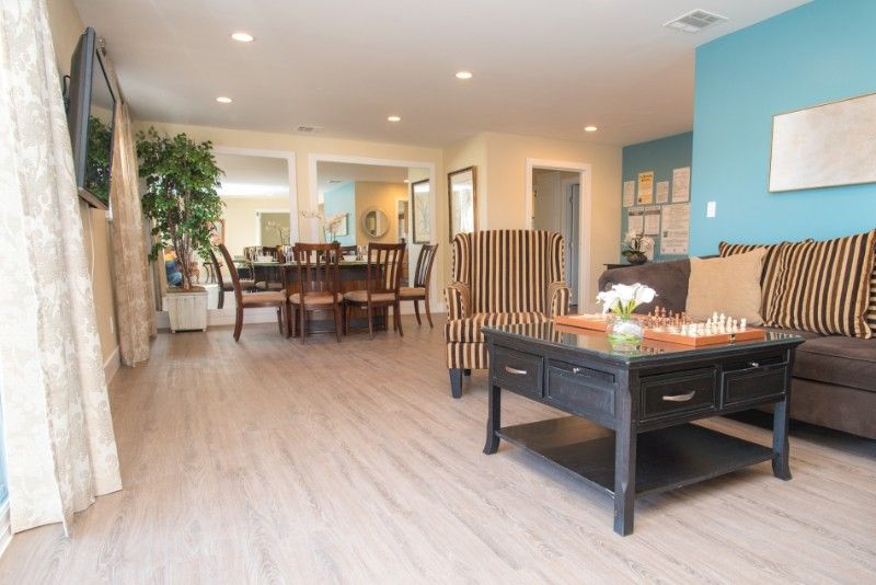 A modern living room with a dining area blending elegance and comfort.