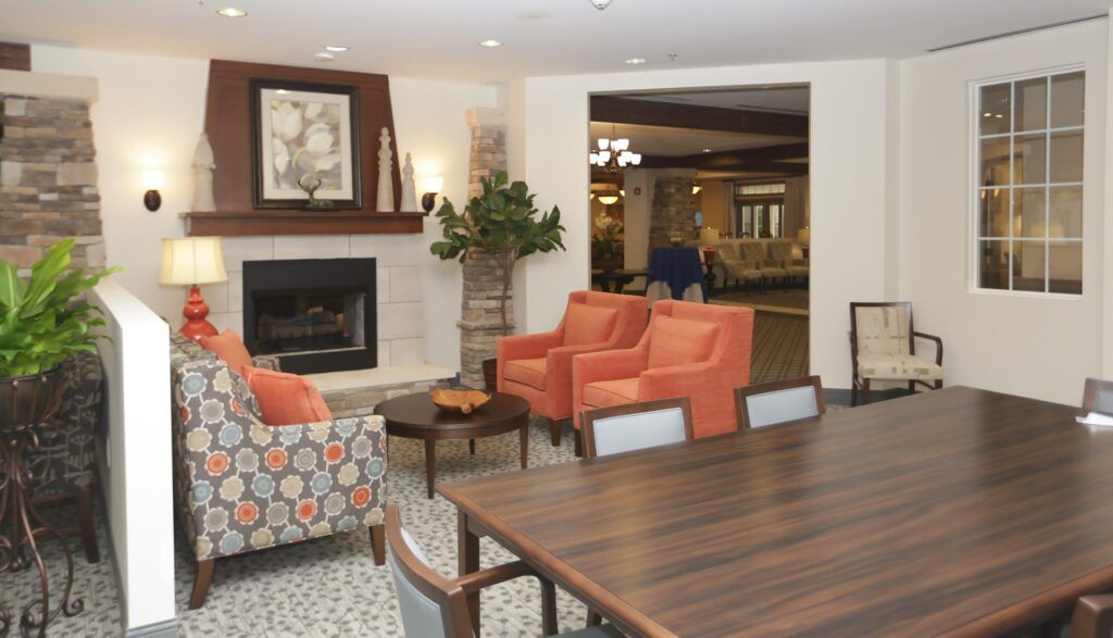 A cozy living room with a fireplace and comfortable seating area.