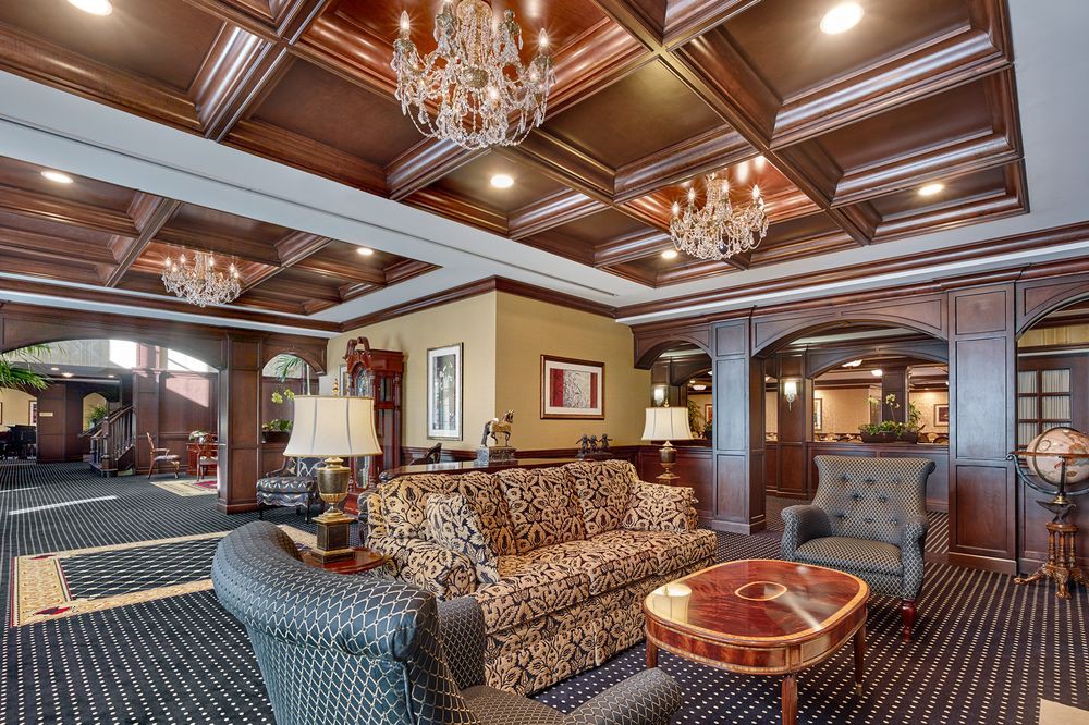 Luxurious hotel lobby with elegant chandeliers and classic furniture.