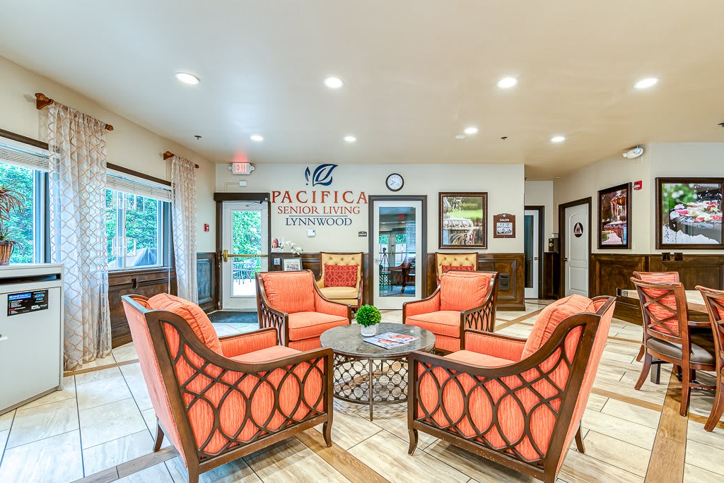 A well-lit lobby with comfortable seating and elegant interior design.