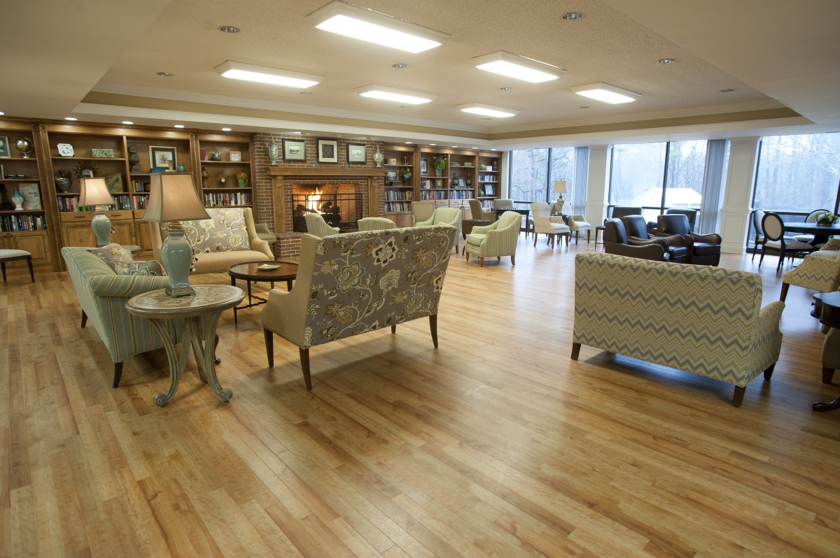 A spacious living room with elegant furniture and large windows.