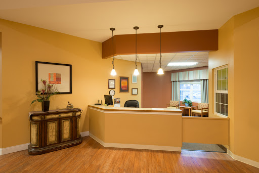 A welcoming reception area featuring modern decor and warm colors.