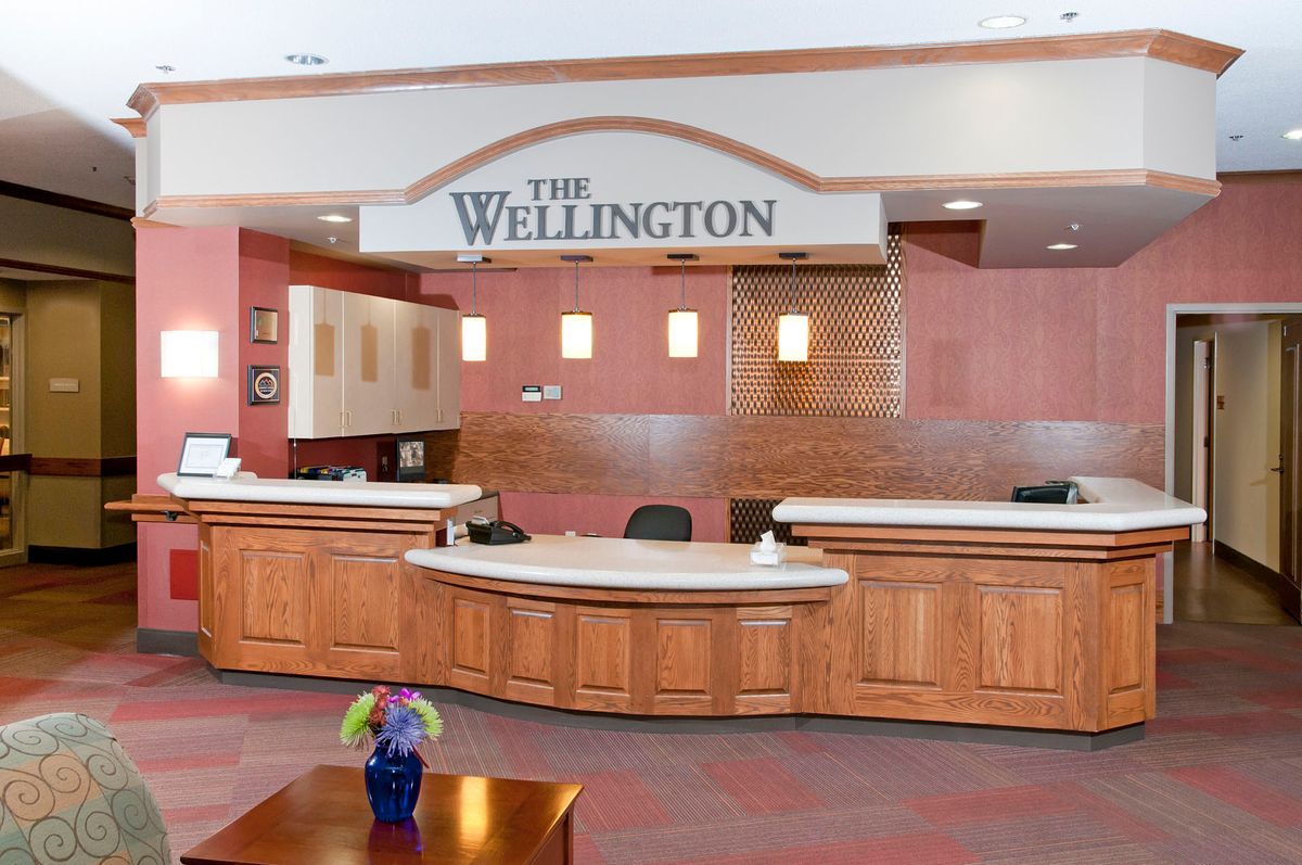The reception area of a facility named 'The Wellington'.