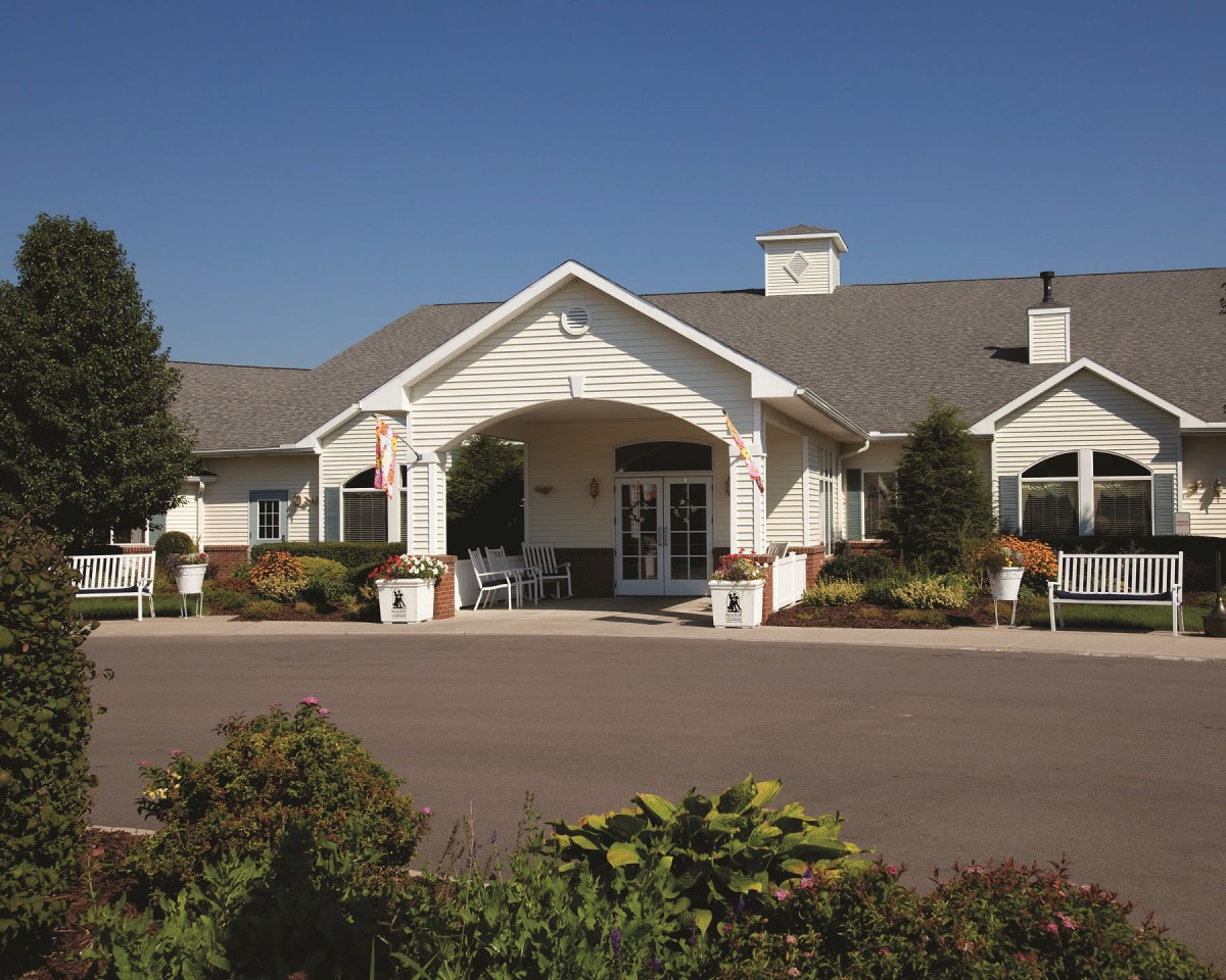 A well-maintained residential building with a welcoming entrance and landscaped surroundings.