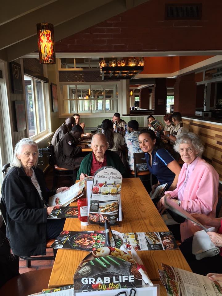 A group of people dining together at a restaurant.