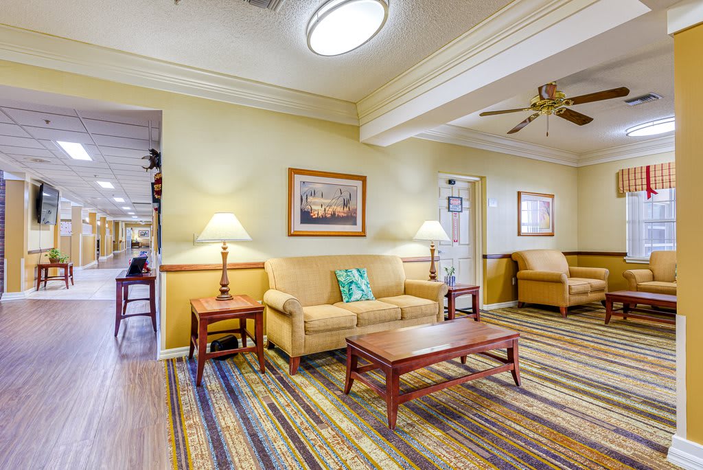 A cozy living room with comfortable seating and warm lighting.
