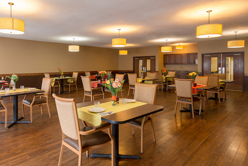 A cozy dining area with elegant decor and well-arranged tables, perfect for enjoying a meal.