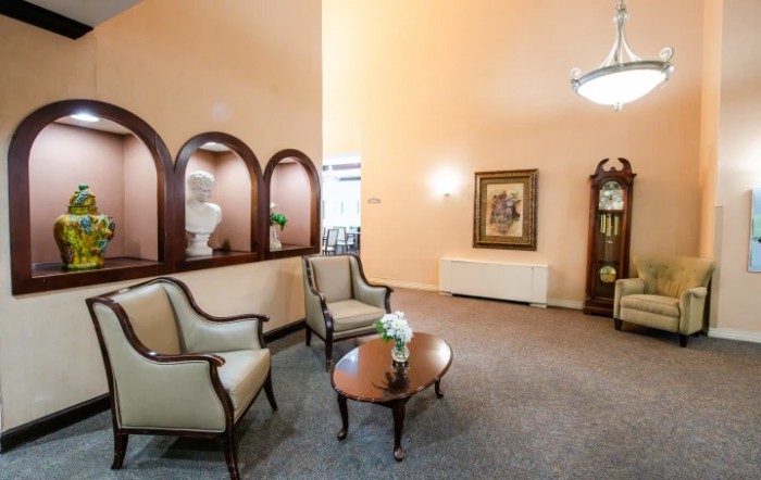 A cozy living room with elegant furniture and decor.