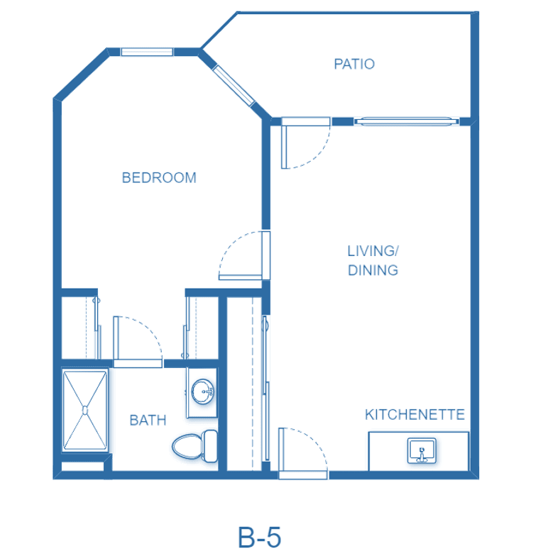 A blueprint of a one-bedroom apartment with a living area, kitchenette, bathroom, and patio.