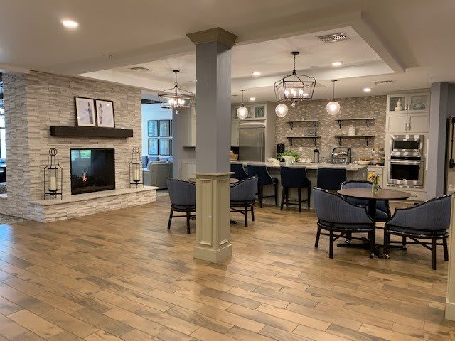 A spacious open-concept living room and kitchen with modern decor.