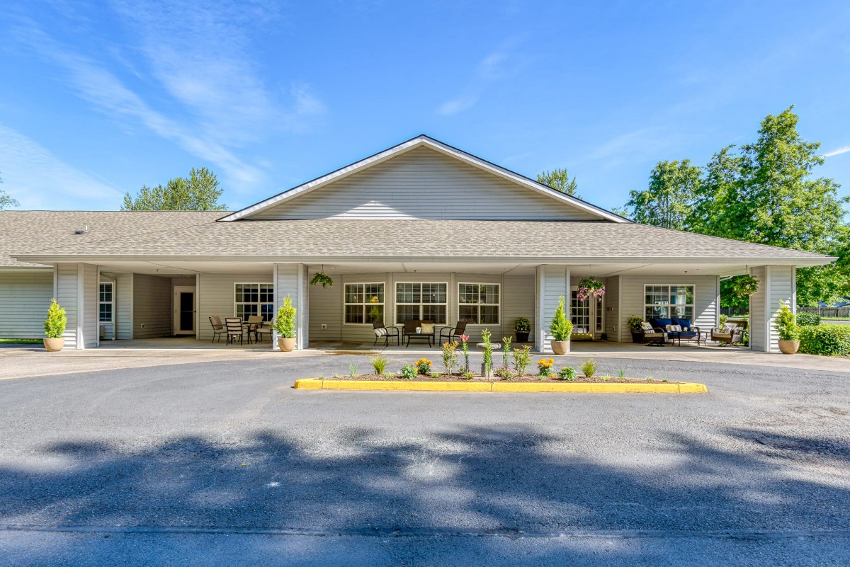 Exterior view of a building with a welcoming entrance and landscaped surroundings.