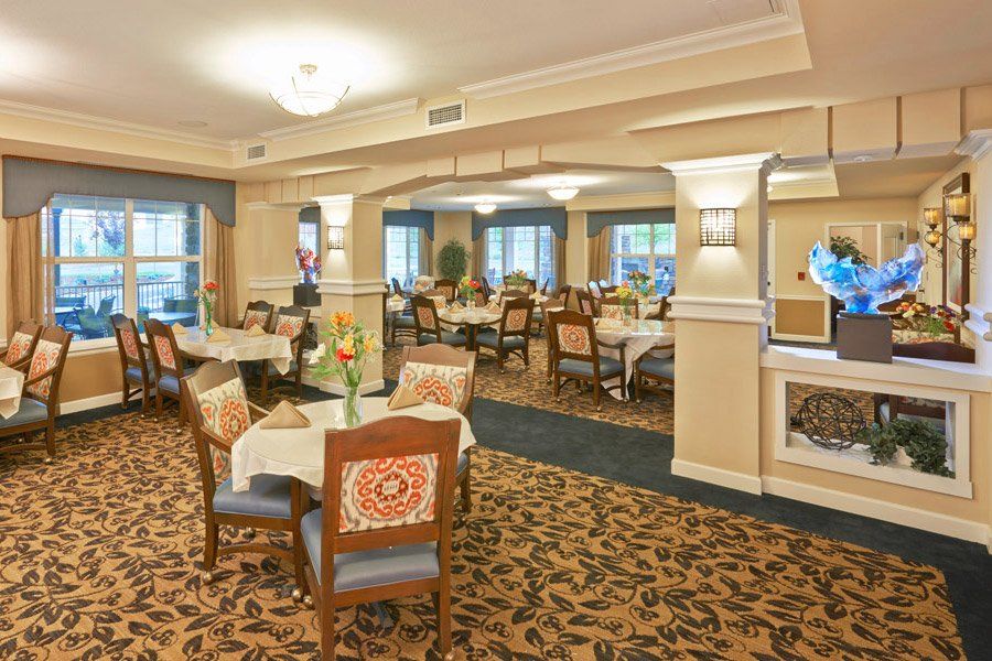 Elegant dining room with neatly arranged tables and comfortable seating.