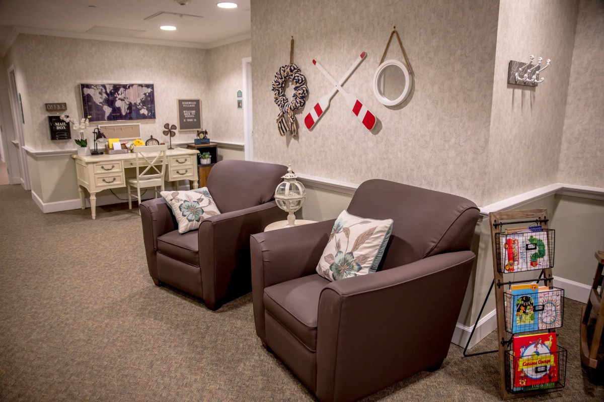 A cozy waiting room with comfortable armchairs and stylish wall decor.