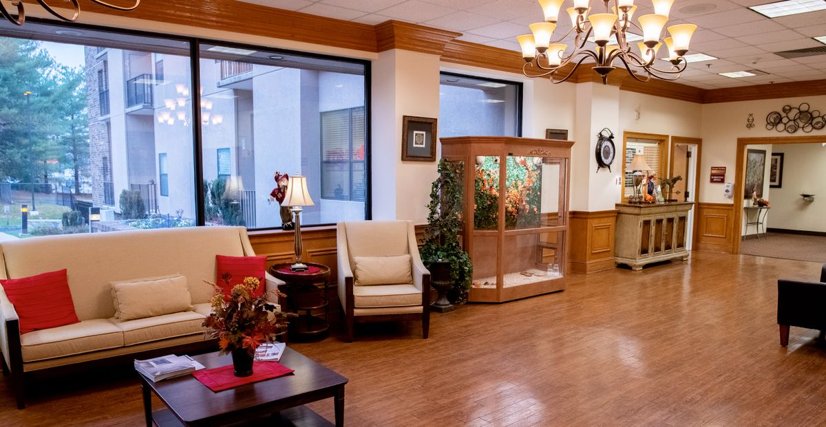 A cozy lobby with seating, decor, and elegant lighting.